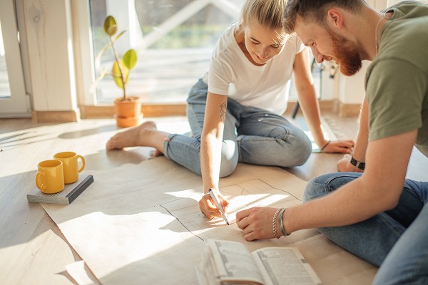 Remove  Portrait of happy caucsian couple planning new house design looking at paper